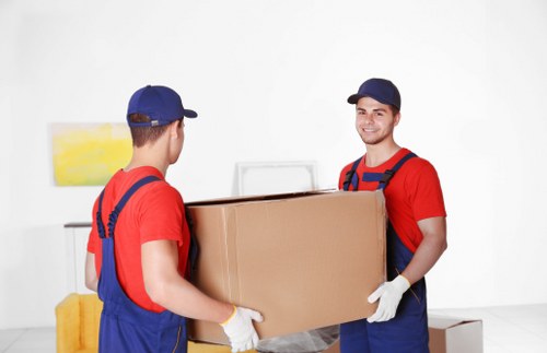 Moving team preparing safely with packed van and property protection