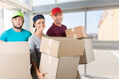 Staff using safe lifting methods during a man and van move