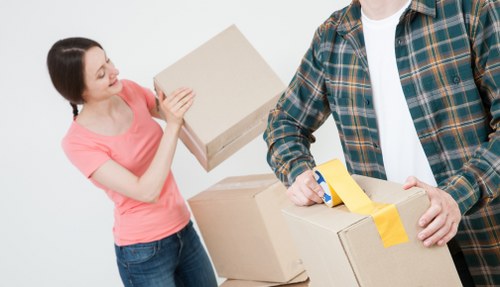 Packed moving boxes and furniture ready for house removals in Nottinghill