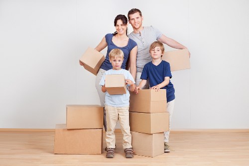 Van loading process showing secure placement of furniture and boxes
