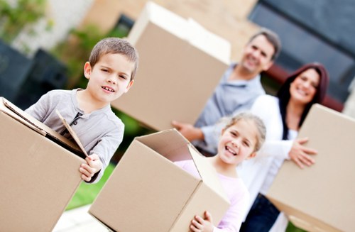 Packed moving boxes and furniture ready for transport in a Notting Hill property
