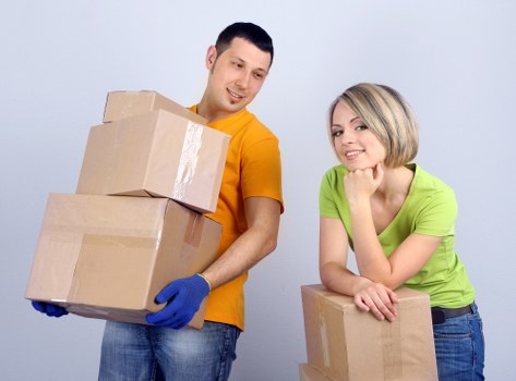 Staff member using safe lifting technique during a house move