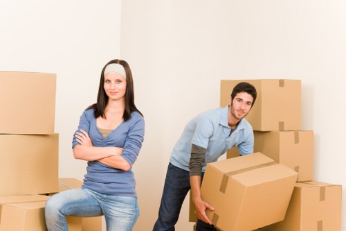 Professional movers loading boxes for an urgent relocation in Notting Hill