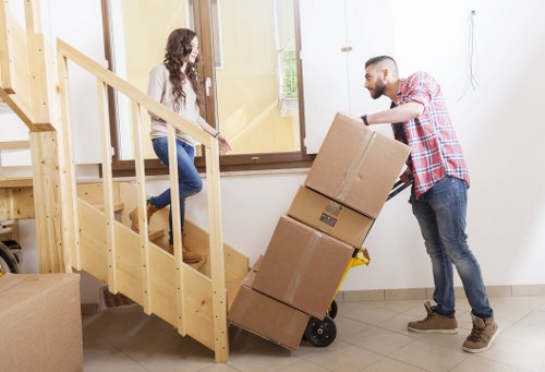 Professional movers handling office furniture during a Notting Hill move